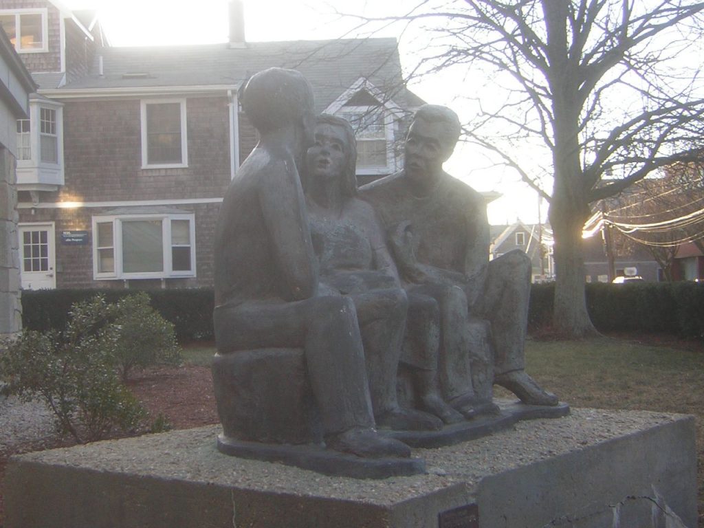 Statue of three people sitting