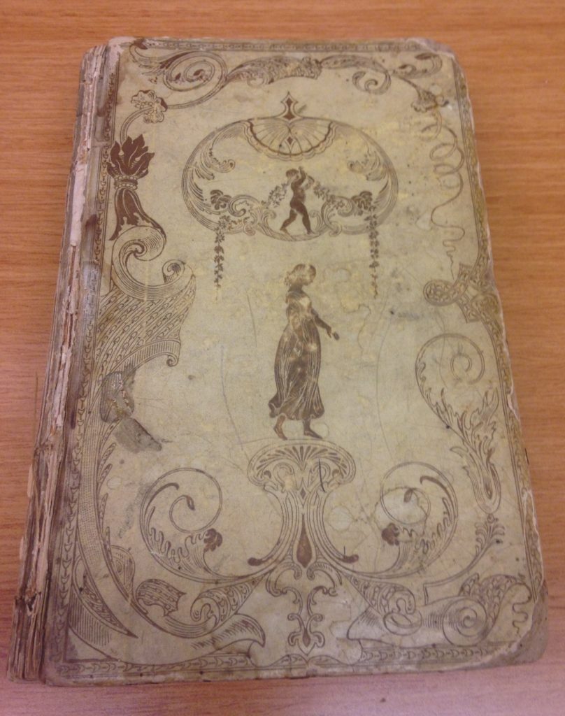 book with light binding and imprint of woman on cover