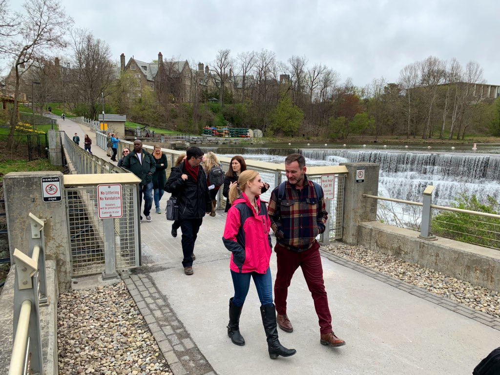Group of people crossing a bridge.
