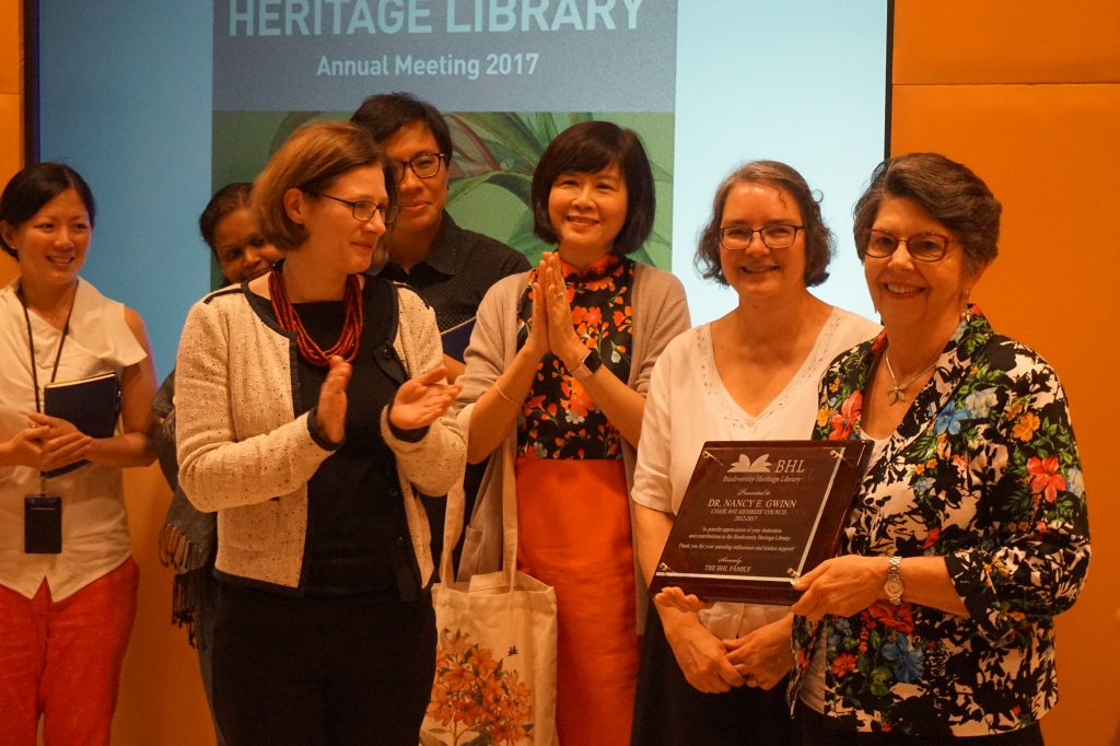 group of people presenting a plaque