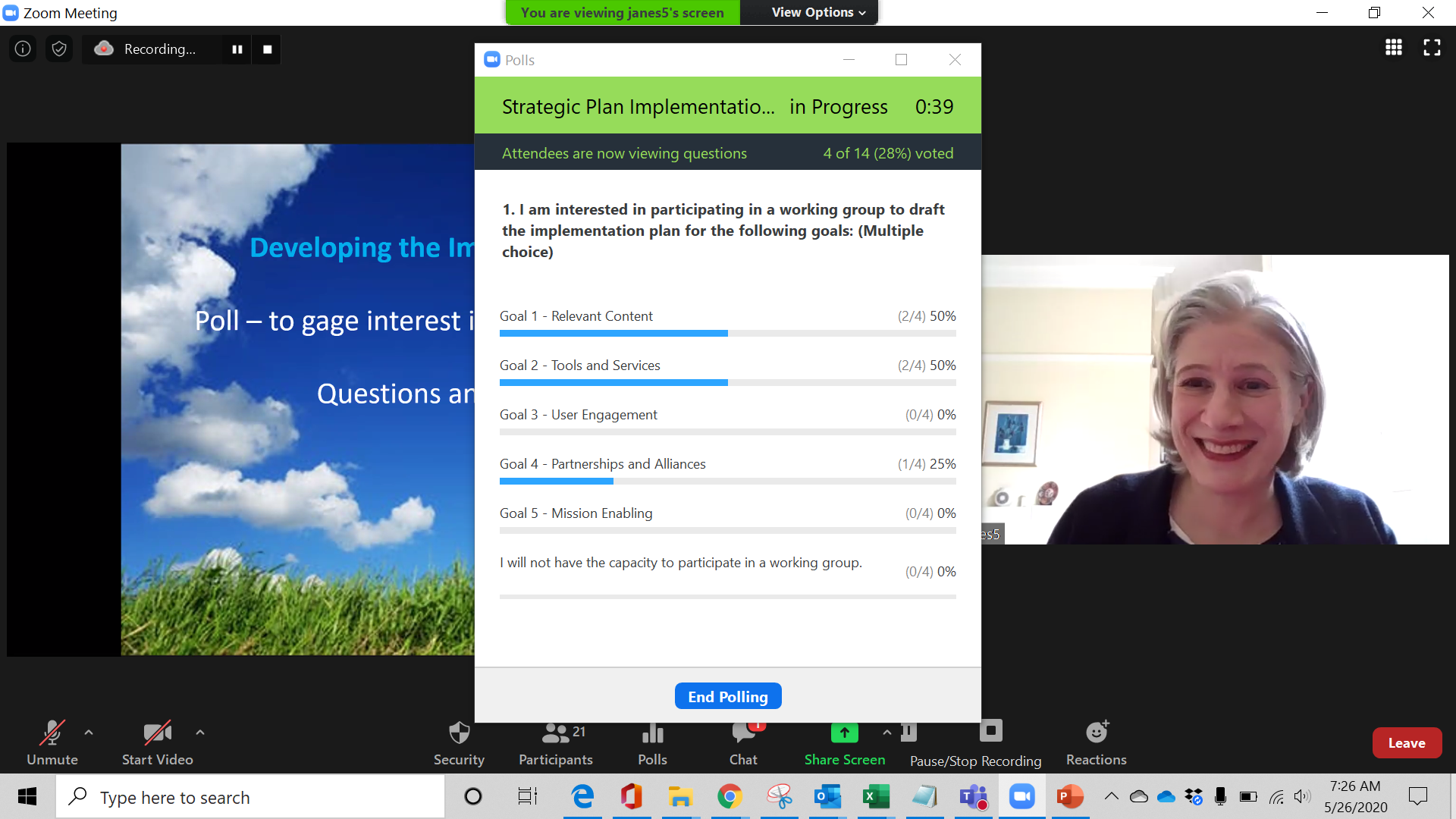 An on-screen poll in a video conference in front of a video feed of a woman's face