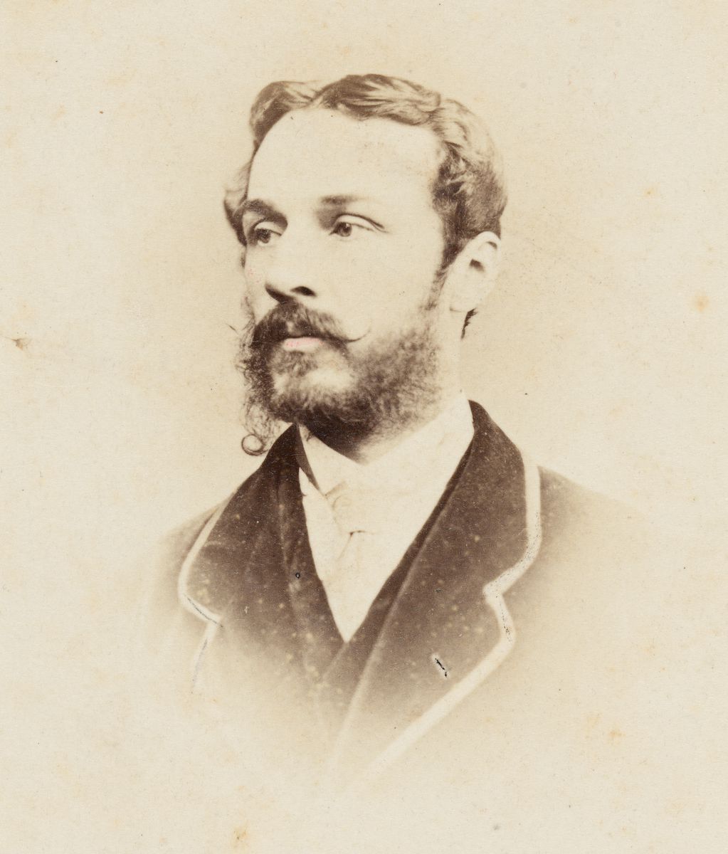 black and white portrait of a person with a short beard.