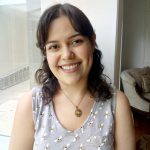 photo of a woman in a pale purple shirt with dark hair