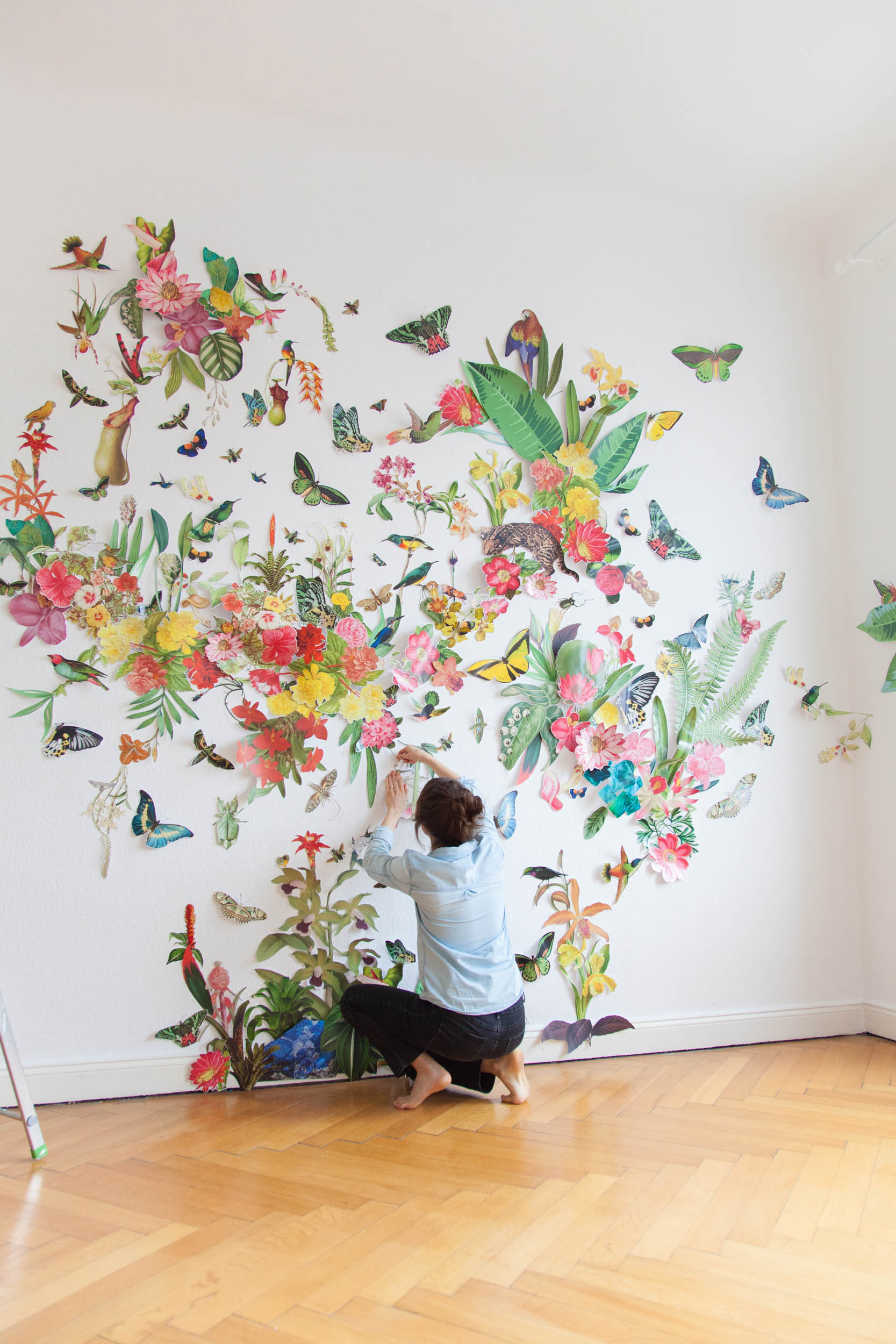 collage installation art featuring various biodiversity figures