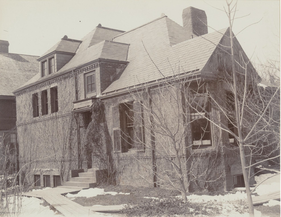 Black and white photograph of a brick house.