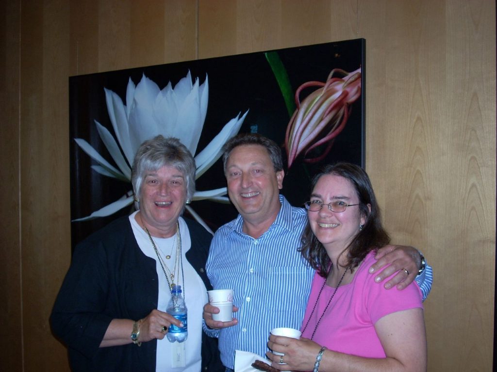 Cathy Norton, Graham Higley, and Connie Rinaldo smile for a group photo