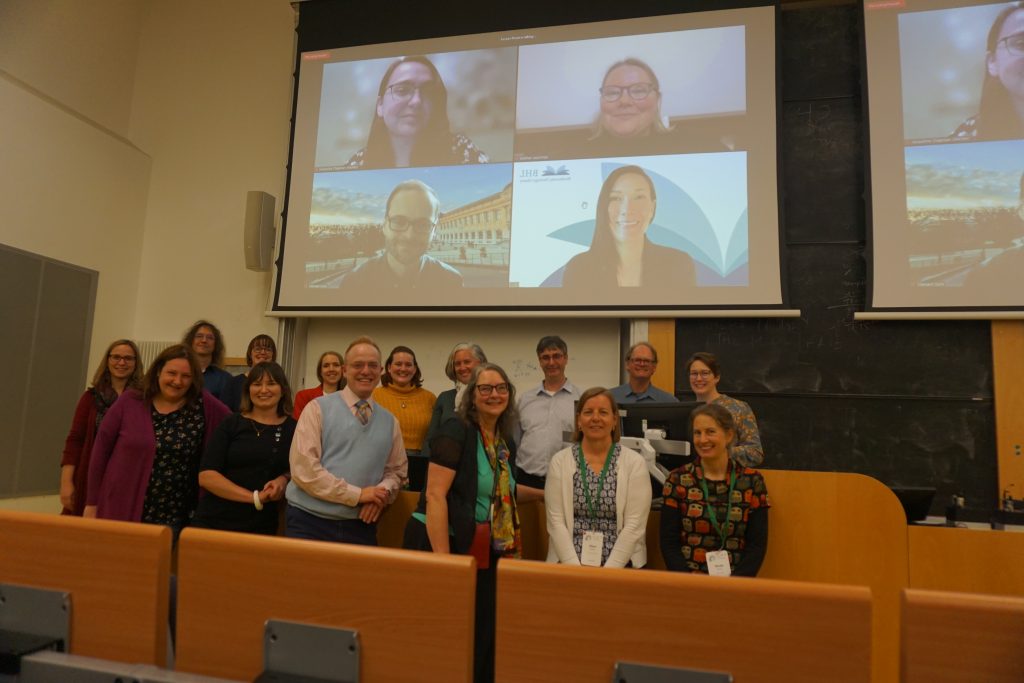 Connie Rinaldo poses with fellow BHL staff and partners for a group photo in a lecture hall