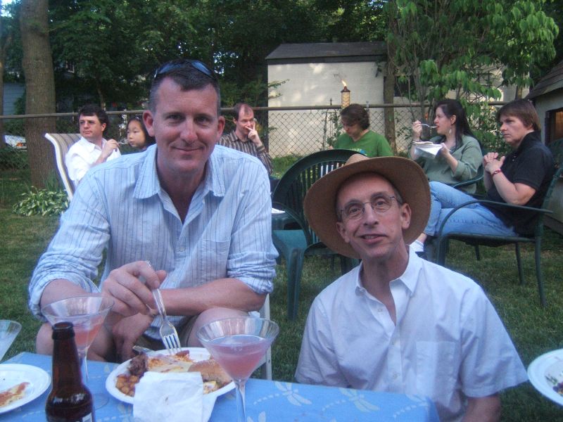 David Remsen and Tom Garnett enjoy a meal with colleagues