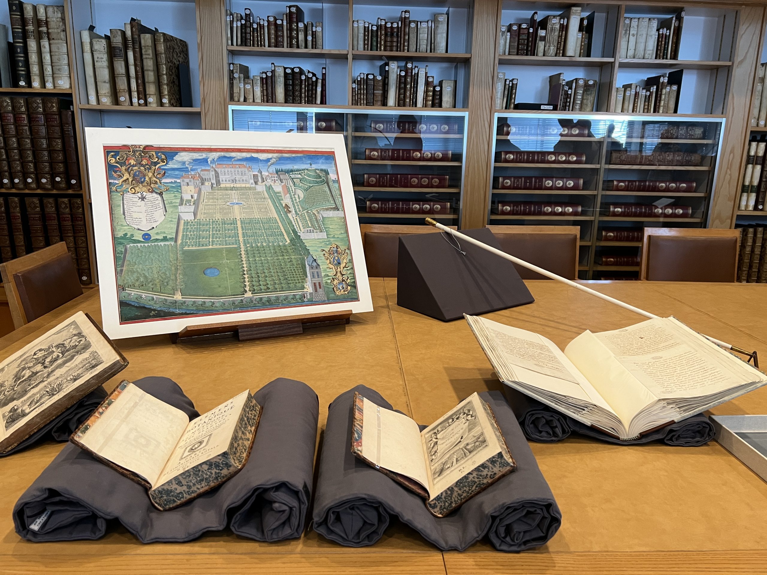 A selection of rare books on display cradles in the vellum room