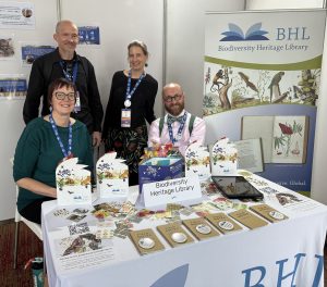 Image of BHL staff behind the BHL Booth at Living Data 2025